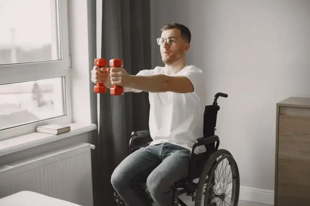 Image of man doing exercise in his wheelchair to aid weight loss England
