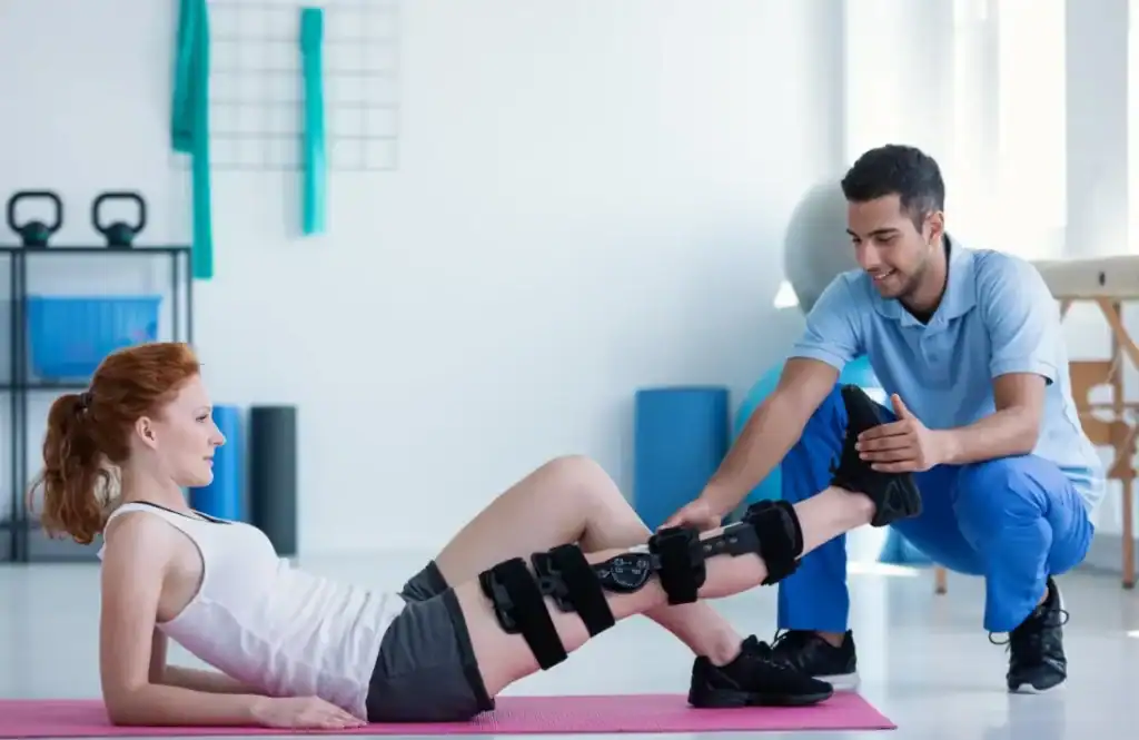 Woman having treatment to help muscle recovery England after an injury