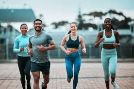 Sculpting Sleek Arms: The Essential Role of Cardio in Toning Without Bulking Up 3 image of people running to incorporate cardio England exercise into their life to help tone arms and body.